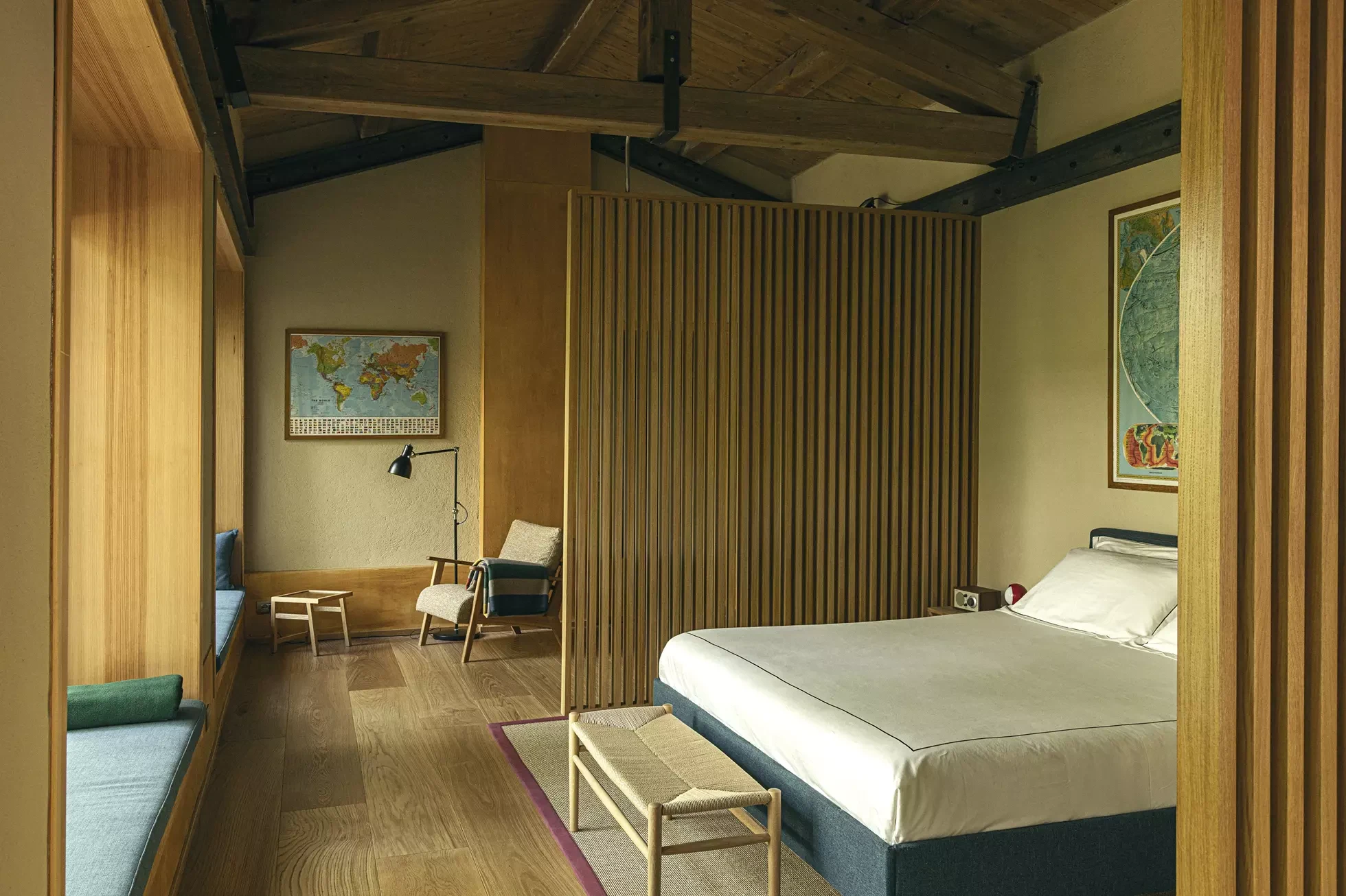 A wood-lined guest room at Oasy Hotel