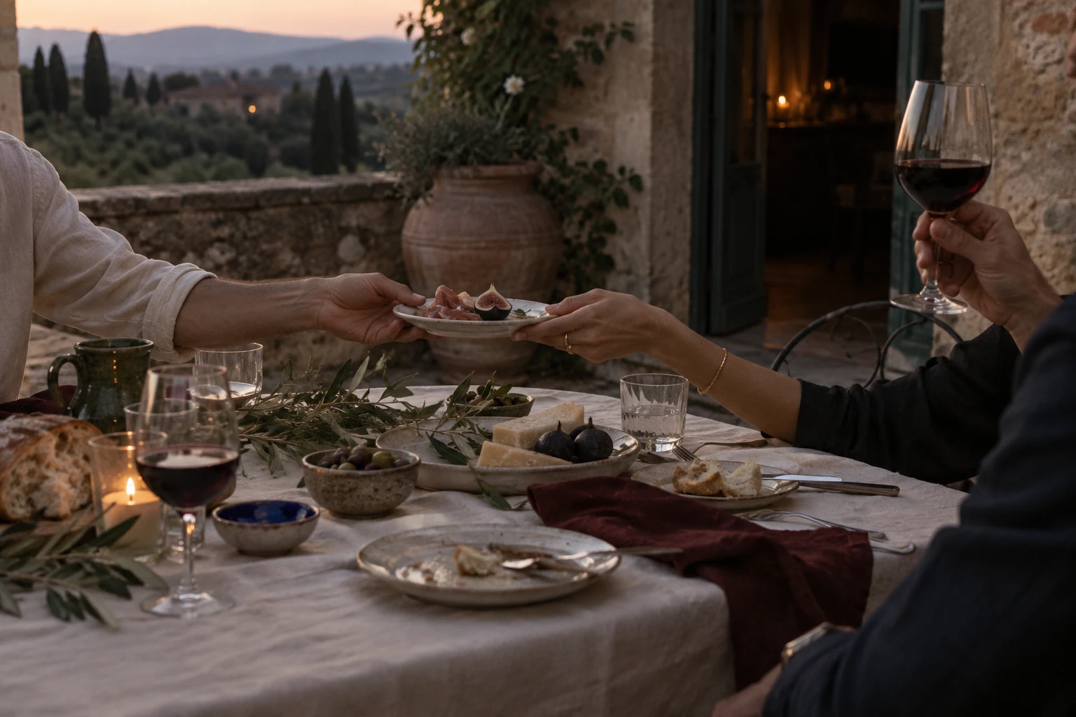 Sharing food on a terrace at dusk